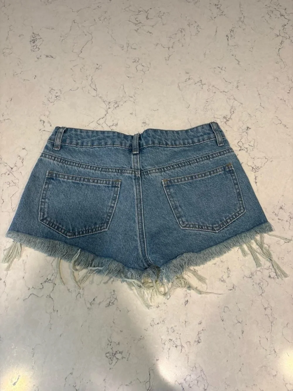 Edikted Distressed Light Blue Denim Cutoff Shorts